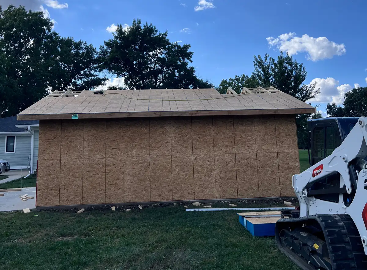 Shed construction with a Bobcat skid steer on site